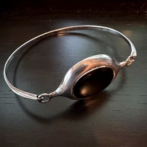 Sterling silver bracelet with black gemstone.